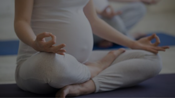 Pregnant woman doing yoga